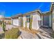 Charming home with desert landscaping, a paved walkway, and a modern exterior design, providing a welcoming entrance at 4924 E Cactus Canyon Dr, Pahrump, NV 89061