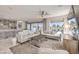 Spacious living room with modern furniture, recessed lighting, and sliding glass doors to the backyard at 4924 E Cactus Canyon Dr, Pahrump, NV 89061