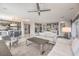 Bright and open living room featuring a comfortable sofa, modern lighting, and stylish decor at 4924 E Cactus Canyon Dr, Pahrump, NV 89061