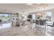 Bright and open concept living area with marble flooring, modern furniture, and a dining space at 4924 E Cactus Canyon Dr, Pahrump, NV 89061