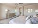Spacious main bedroom with modern furnishings, walk-out balcony, and a stylish accent mirror at 4924 E Cactus Canyon Dr, Pahrump, NV 89061