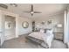 Serene primary bedroom with lots of natural light, neutral tones, and golf course views at 4924 E Cactus Canyon Dr, Pahrump, NV 89061