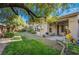 Large backyard featuring mature landscaping, covered patio, and ample space for entertaining guests at 4996 Del Pueblo Ave, Las Vegas, NV 89141