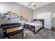 Comfortable bedroom featuring a bed, couch, and rustic accents for a cozy feel at 4996 Del Pueblo Ave, Las Vegas, NV 89141