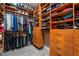 Walk-in closet with custom shelving, hanging racks, and drawers for optimal organization at 4996 Del Pueblo Ave, Las Vegas, NV 89141