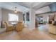 Formal dining area showcasing an open floor plan, neutral tones, and ample natural light at 4996 Del Pueblo Ave, Las Vegas, NV 89141