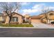 Charming single-story home features a two-car garage, landscaped front yard, and stucco exterior at 4996 Del Pueblo Ave, Las Vegas, NV 89141
