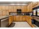 Gourmet kitchen with stainless steel appliances and granite countertops at 4996 Del Pueblo Ave, Las Vegas, NV 89141