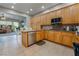 Well-equipped kitchen boasts stainless appliances and wood cabinets at 4996 Del Pueblo Ave, Las Vegas, NV 89141