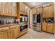 Spacious kitchen with stainless steel appliances and ample cabinet space at 4996 Del Pueblo Ave, Las Vegas, NV 89141