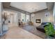 Spacious living room boasts stylish decor, neutral paint, a fireplace, and ample natural lighting at 4996 Del Pueblo Ave, Las Vegas, NV 89141