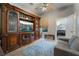 Comfortable living room featuring a beautiful entertainment center and a plush blue rug at 4996 Del Pueblo Ave, Las Vegas, NV 89141