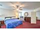 Bedroom featuring a bed, dresser, and sitting chair under a ceiling fan at 5024 Granite Creek Ct, Las Vegas, NV 89131