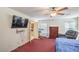 This bedroom has a TV, door to bathroom, and a chair near the window at 5024 Granite Creek Ct, Las Vegas, NV 89131