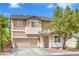 Charming two-story home with a well-manicured front yard and attached two-car garage at 5024 Granite Creek Ct, Las Vegas, NV 89131