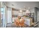 Bright kitchen featuring white cabinets, stainless steel appliances, and a breakfast nook with sliding glass doors at 5024 Granite Creek Ct, Las Vegas, NV 89131
