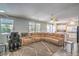 Spacious living room features hardwood floors, a large sectional sofa, and ceiling fans at 5024 Granite Creek Ct, Las Vegas, NV 89131