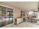 Covered patio with outdoor seating, a stainless steel storage unit, and view of a swimming pool at 5024 Granite Creek Ct, Las Vegas, NV 89131