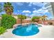 Beautiful backyard pool with lush landscaping, rock accents, and a relaxing spa area at 5024 Granite Creek Ct, Las Vegas, NV 89131