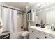 Clean bathroom with shower-tub combo, white vanity, and modern fixtures at 509 Chestnut View Pl, Henderson, NV 89052