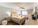 Cozy bedroom featuring neutral tones, a ceiling fan, and a crib, creating a serene and inviting space at 509 Chestnut View Pl, Henderson, NV 89052