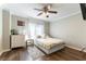 Cozy bedroom featuring hardwood floors, a comfortable bed, and natural lighting at 509 Chestnut View Pl, Henderson, NV 89052