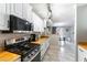 Bright, updated kitchen with butcher block countertops, stainless steel appliances, and white cabinets at 509 Chestnut View Pl, Henderson, NV 89052