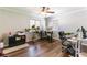 Bright home office featuring hardwood floors, dual workstations, and ample lighting at 509 Chestnut View Pl, Henderson, NV 89052
