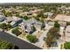 Gorgeous aerial view of a two-story home with desert landscaping, driveway, and a three-car garage at 5128 Blissful Valley Cir, Las Vegas, NV 89149