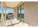 Balcony with decorative posts and railing, offering a view of the surrounding neighborhood at 5128 Blissful Valley Cir, Las Vegas, NV 89149