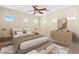 Stylishly furnished bedroom featuring a wooden dresser and a plush bed with decorative pillows at 5128 Blissful Valley Cir, Las Vegas, NV 89149