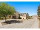 Beautiful home with a spacious driveway, three car garage, and mature landscaping at 5128 Blissful Valley Cir, Las Vegas, NV 89149