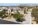 Beautiful home with a three-car garage, a guest house, and lovely landscaping at 5128 Blissful Valley Cir, Las Vegas, NV 89149