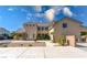 Expansive home showcasing a large driveway, desert landscaping, and a private gated entrance at 5128 Blissful Valley Cir, Las Vegas, NV 89149