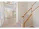Bright foyer with a staircase, tile flooring, and a view into the living area and front door at 5128 Blissful Valley Cir, Las Vegas, NV 89149