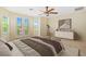 Cozy main bedroom with large windows, neutral tones, and ample natural light for a relaxing atmosphere at 5128 Blissful Valley Cir, Las Vegas, NV 89149
