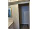 This bathroom features a shower, white walls and cabinets, a large mirror, and modern fixtures, a functional space at 5175 Palmyra Ave, Las Vegas, NV 89146