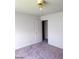 This bedroom features neutral carpet, ceiling fan and access to closet at 5175 Palmyra Ave, Las Vegas, NV 89146