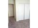 Bedroom showing the neutral carpet and a sliding door closet for ample storage at 5175 Palmyra Ave, Las Vegas, NV 89146