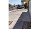 A side view showing the concrete driveway and parked car at 5175 Palmyra Ave, Las Vegas, NV 89146