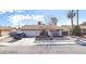 Inviting single-story home with attached garage, manicured front yard and arched entry way at 5175 Palmyra Ave, Las Vegas, NV 89146