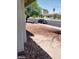 A view of the front yard showing the sidewalk, grass, and a parked vehicle at 5175 Palmyra Ave, Las Vegas, NV 89146