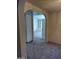 Hallway with an open archway leading into another room with built-in shelving at 5175 Palmyra Ave, Las Vegas, NV 89146