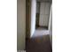 Hallway featuring carpet flooring, white walls and a built-in cabinet at 5175 Palmyra Ave, Las Vegas, NV 89146
