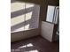 Clean living room with bright window and door frame; neutral color carpet at 5175 Palmyra Ave, Las Vegas, NV 89146