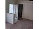 A spacious living room with neutral carpeting, door frame, and baseboard at 5175 Palmyra Ave, Las Vegas, NV 89146