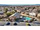 Community pool area featuring a sparkling pool, seating, landscaping, and parking in a residential neighborhood at 5184 Mineral Lake Dr, Las Vegas, NV 89122