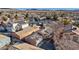 The aerial shot highlights the neighborhood, showcasing the home's location among desert landscaping at 5184 Mineral Lake Dr, Las Vegas, NV 89122