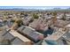 The drone image presents a high-angle view of the residential area set against a backdrop of distant mountains at 5184 Mineral Lake Dr, Las Vegas, NV 89122