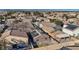 An aerial view of a neighborhood shows how the homes are situated with a mix of rooftops and landscaping at 5184 Mineral Lake Dr, Las Vegas, NV 89122